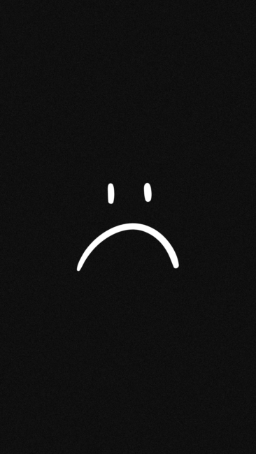 black background with a white sad face drawing