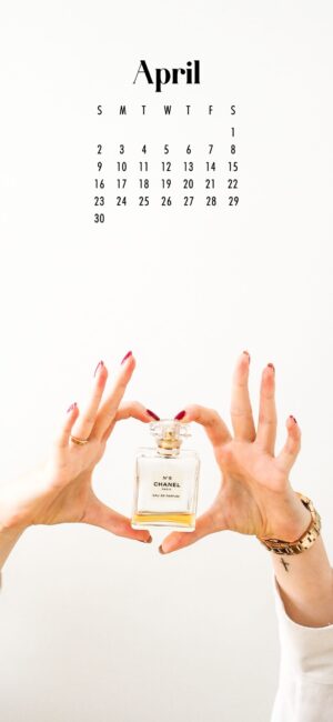 phone wallpaper of female hands holding chanel perfume bottle