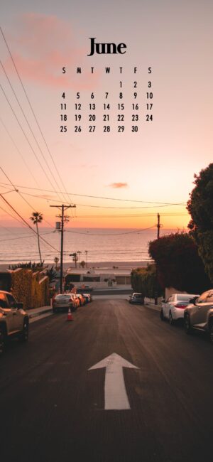 A road and the beach at sunset